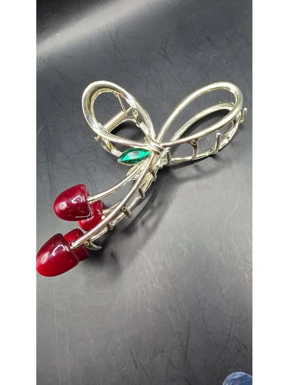 Elegant Gold-Tone Cherry Bow Hair Clip with Red Accents and Green Leaf Detail –